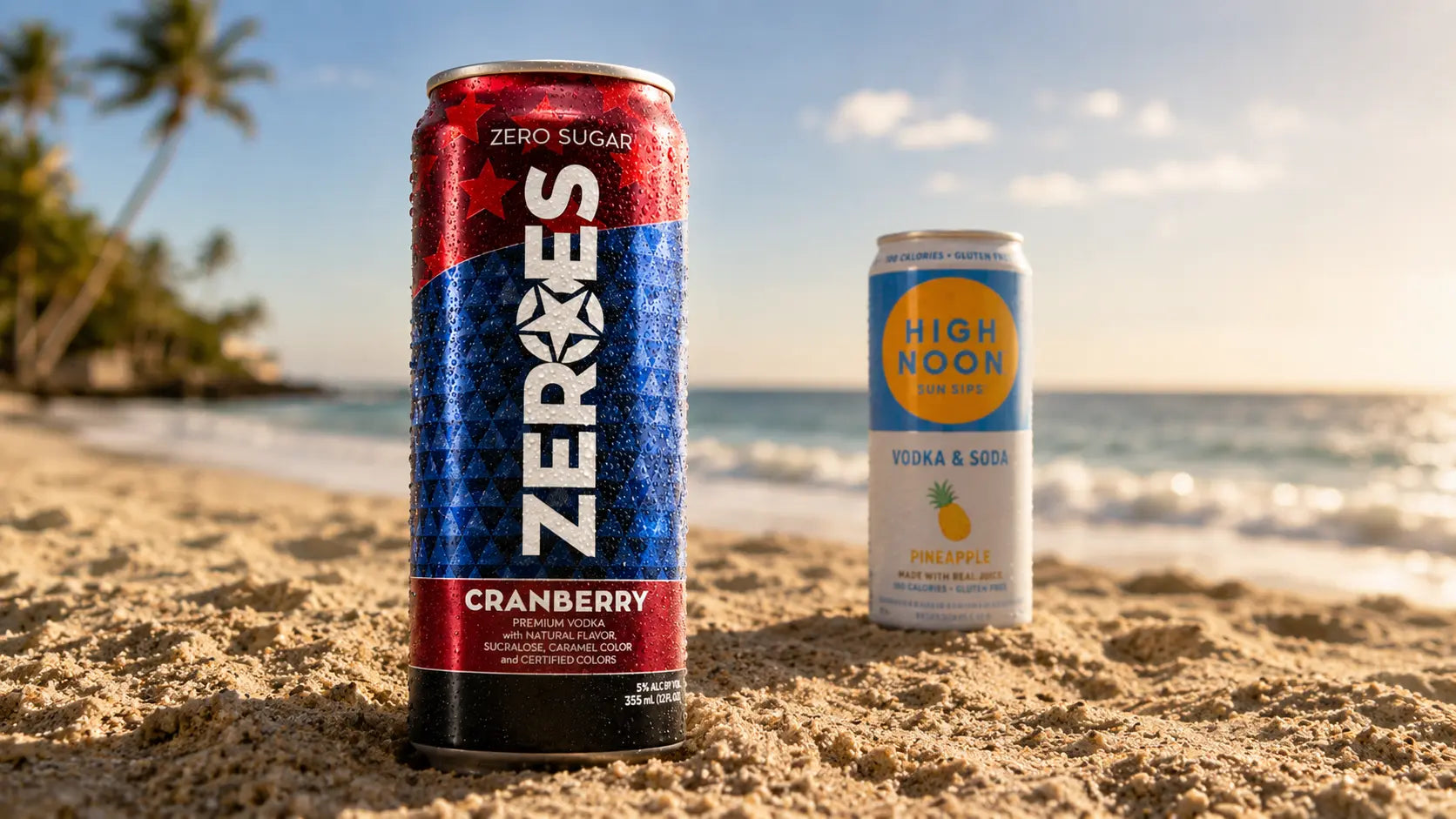 Two cans of ZEROS and High Noon on a sandy beach with ocean view